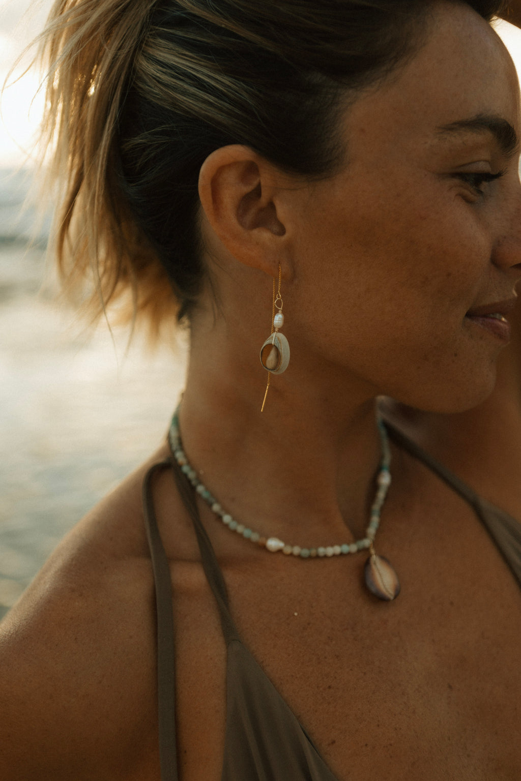Cowrie pearl string earrings